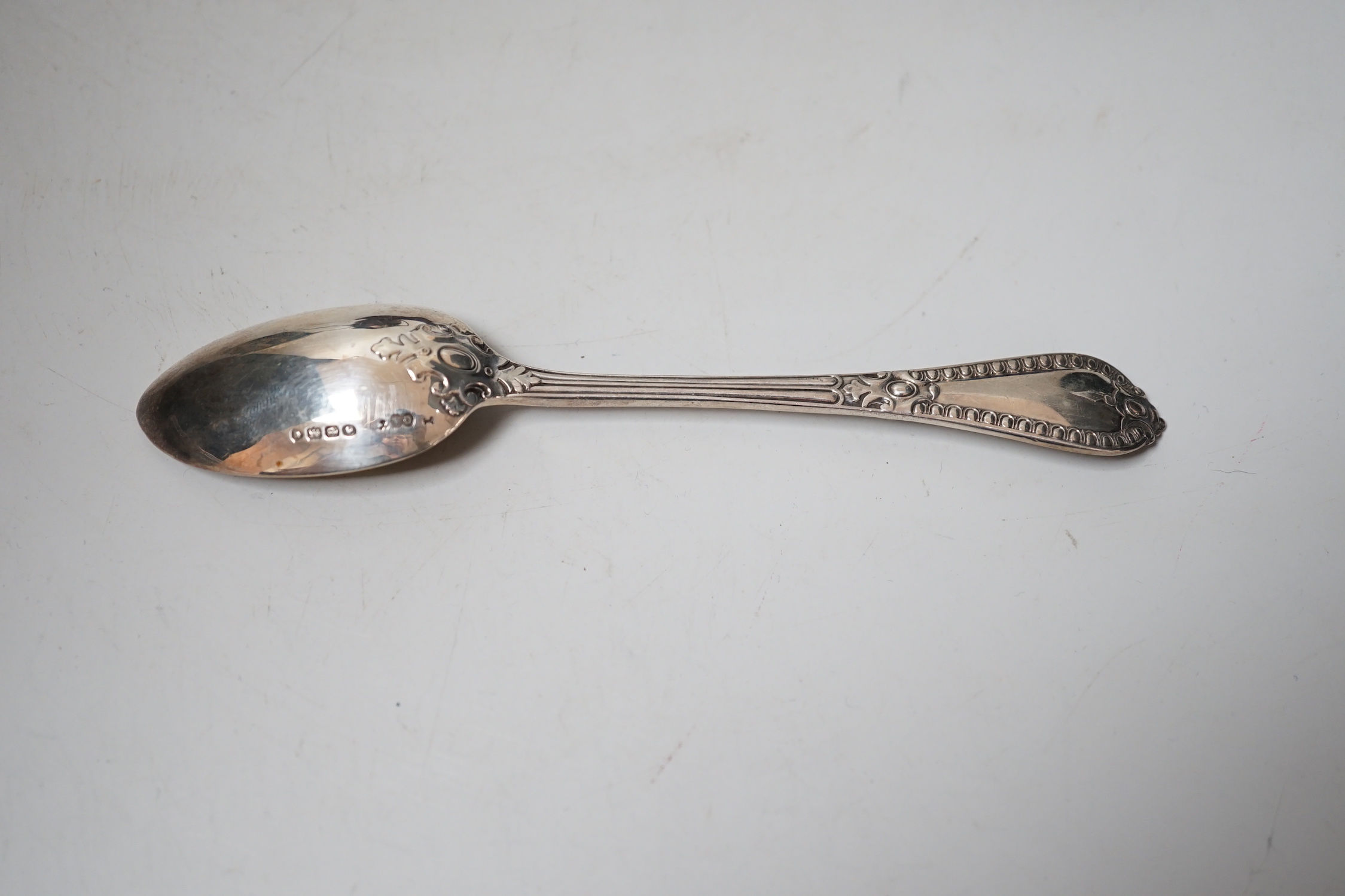 A George V silver christening mug, a cased Victorian silver christening spoon by George Adams and a plated christening mug.